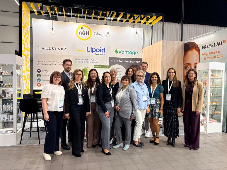 Group photo of HSH Chemie team and partners at HPCI 2026 Warsaw booth with Hallstar, Lipoid, Vantage, FREY&LAU.
