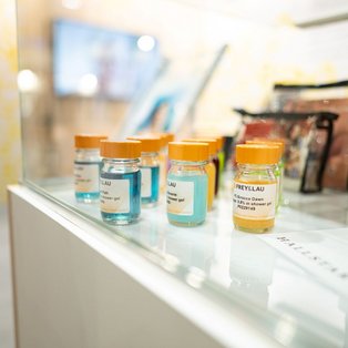 FREY&LAU shower gel samples and dropper bottles at HSH Chemie’s PCI Days booth.