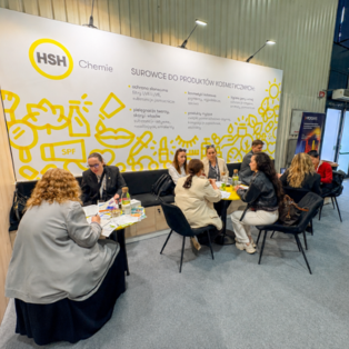 HSH Chemie booth with visitors seated at tables discussing personal care ingredients at PCI Days 2026.