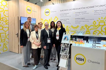 HSH Chemie team standing beside cosmetic ingredient displays at the PCI Days 2026 booth.